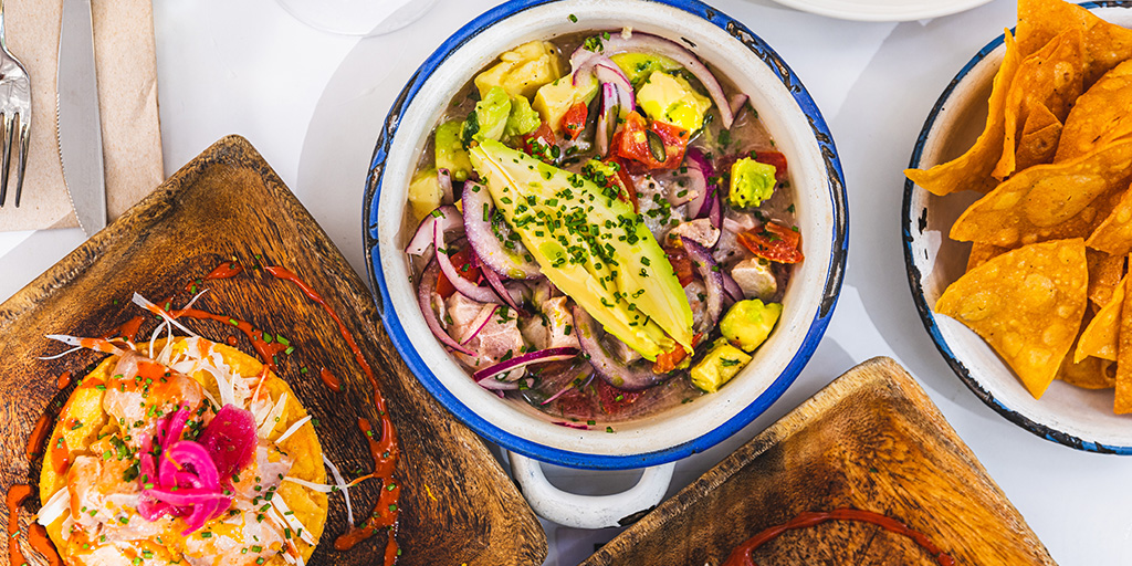 Colorful ceviche with avocado and chips